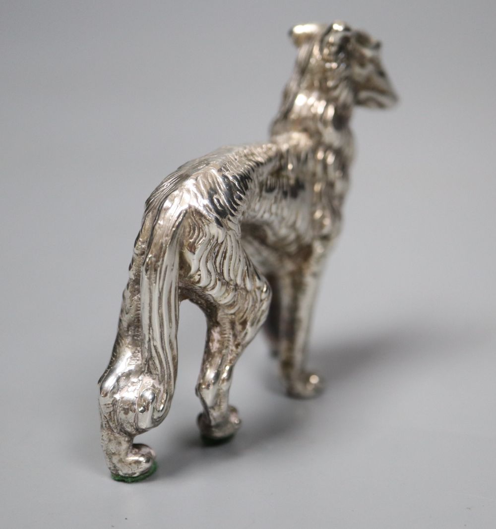 A modern silver model of a dog (filled), height 62mm.